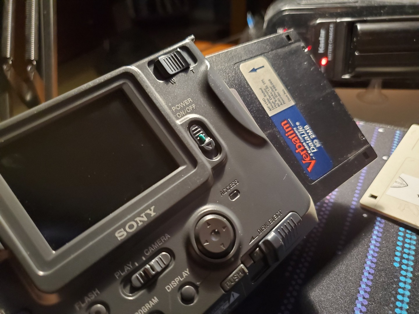 A back view of the MVC-FD75 with a disk half inserted