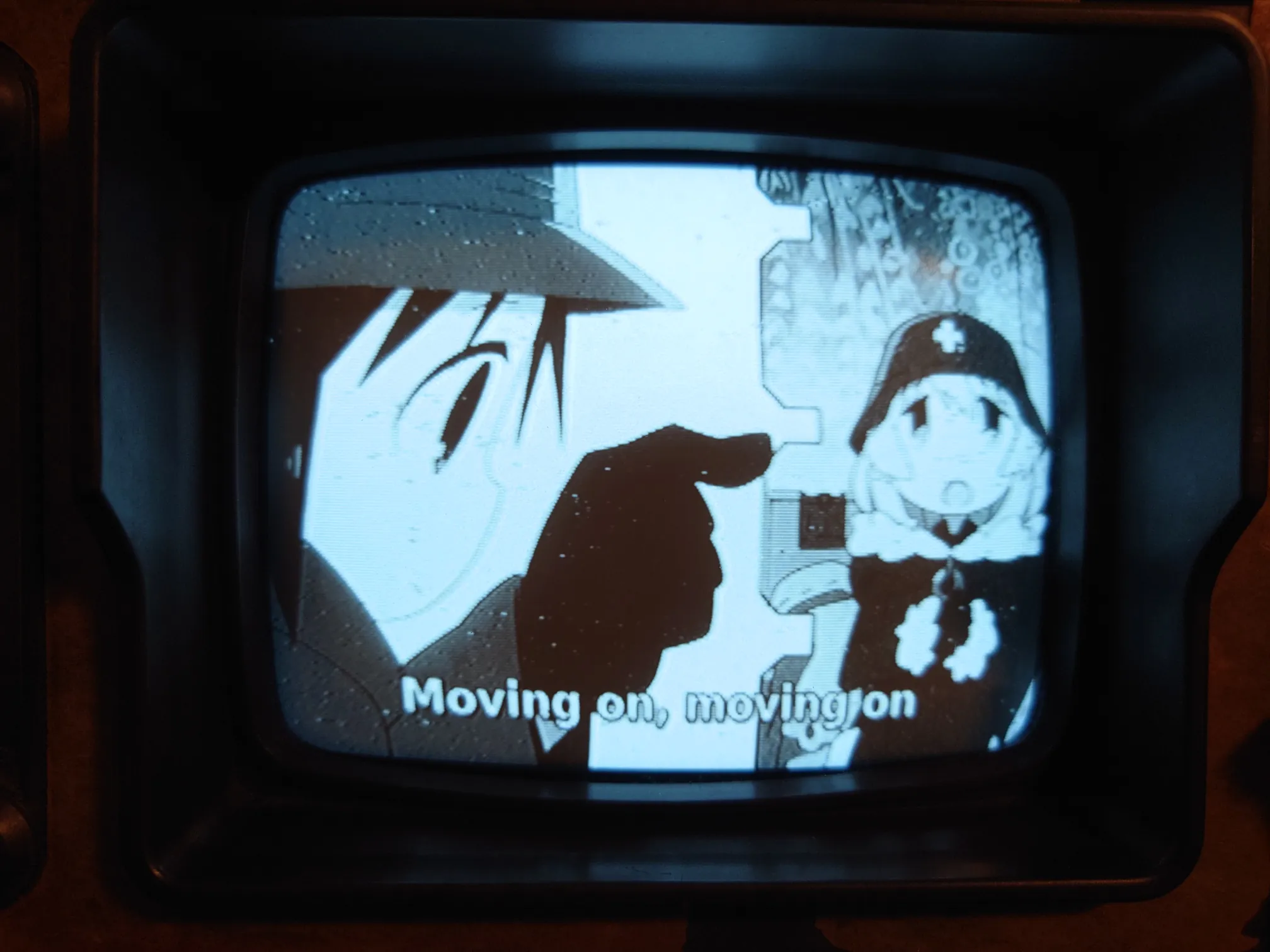 A close up of the screen playing anime